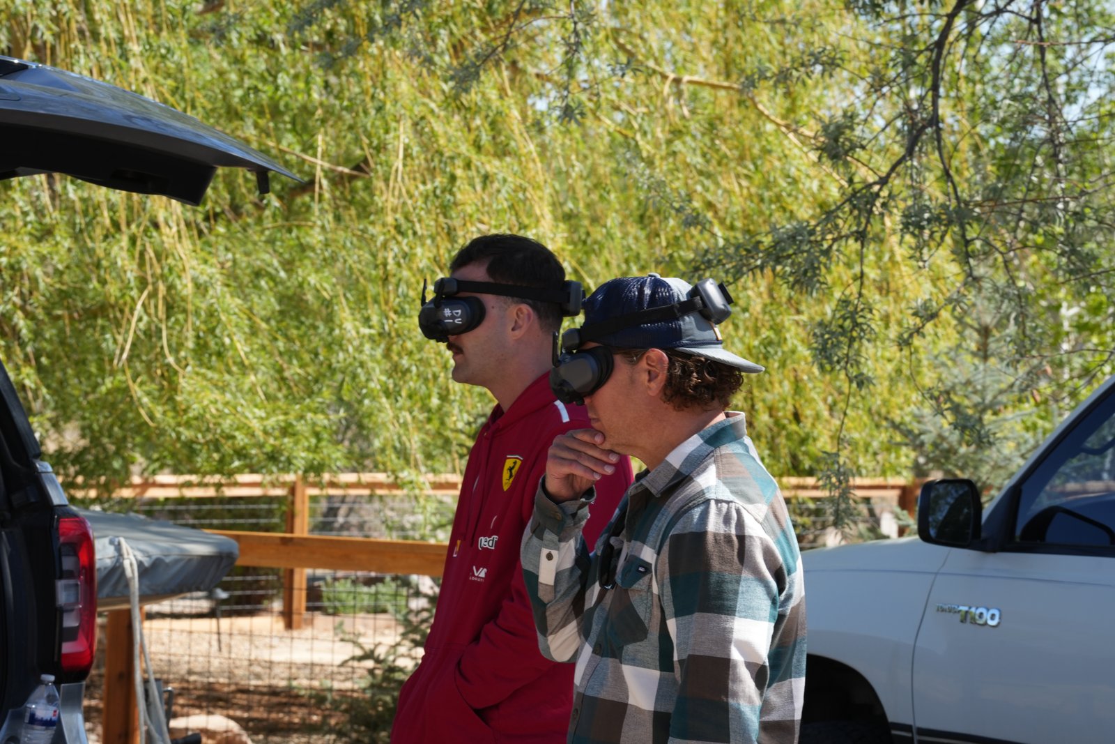 Friends wearing DJI Goggles 3 watching a shared live drone feed side by side