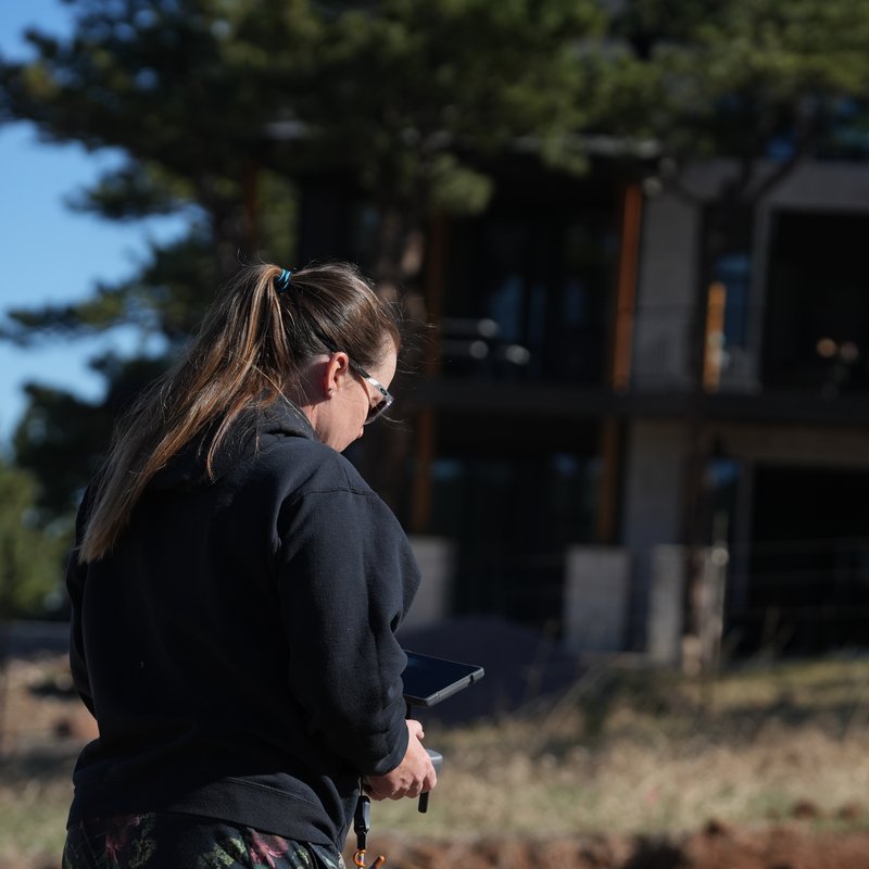 Employee checking a drone flight app, a first step to motivate employees to become drone pilots