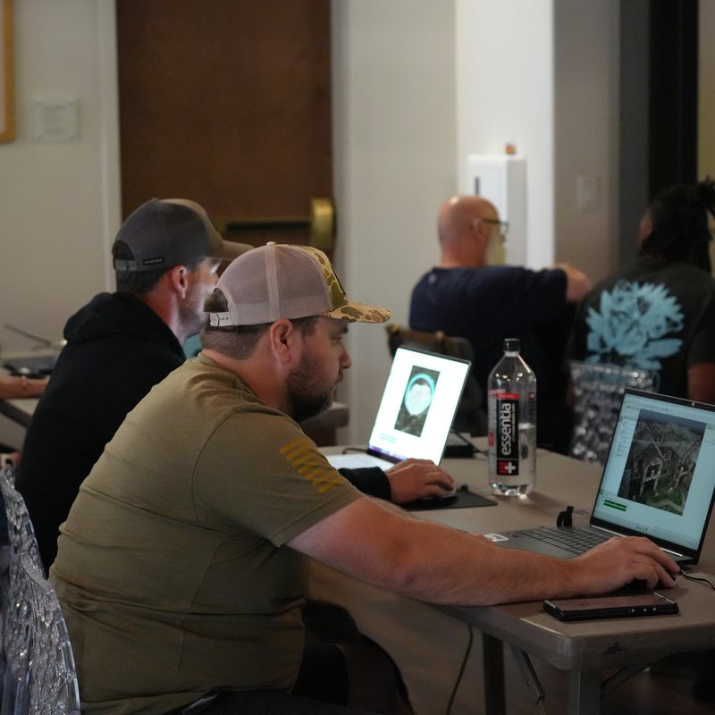Students reviewing drone imagery on laptops while studying for the Part 107 test changes