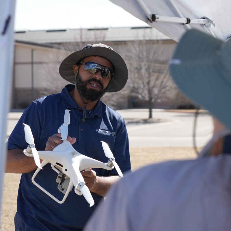 What is a drone - Drone U instructor explaining a Phantom quadcopter to a student